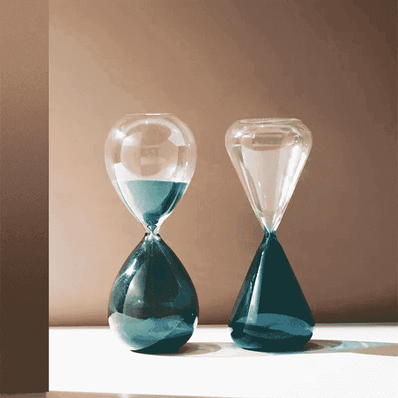 Hour glass with blue sand