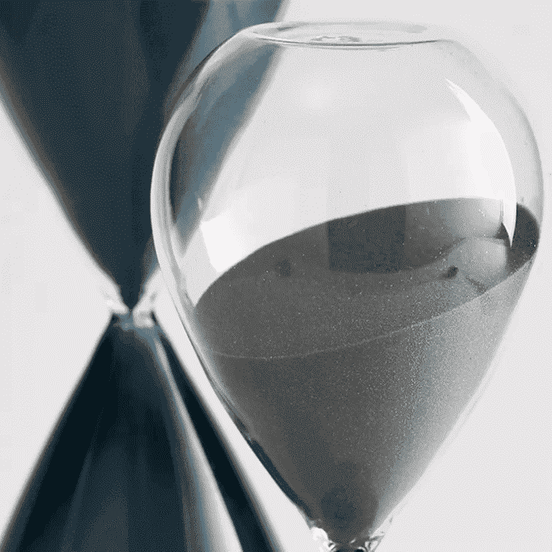 Glass hour glass with sand 