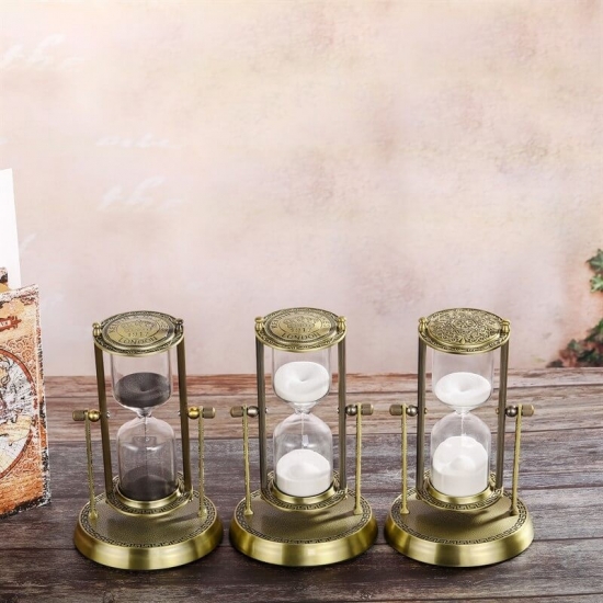 Rotating brass hourglass decor