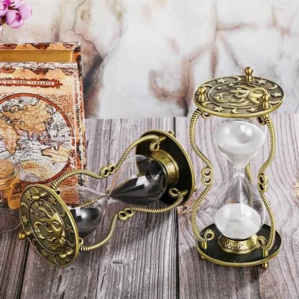 Brass sun hourglass decor