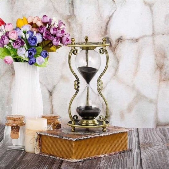 Brass sun hourglass decor
